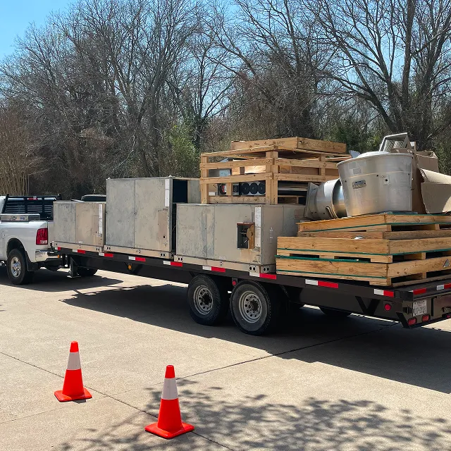 New HVAC equipment on a trailer at a Modern Air Services job site