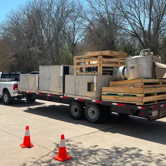 New HVAC equipment on a trailer at a Modern Air Services job site